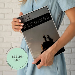 Women holding issue 1 of Isle Weddings magazine